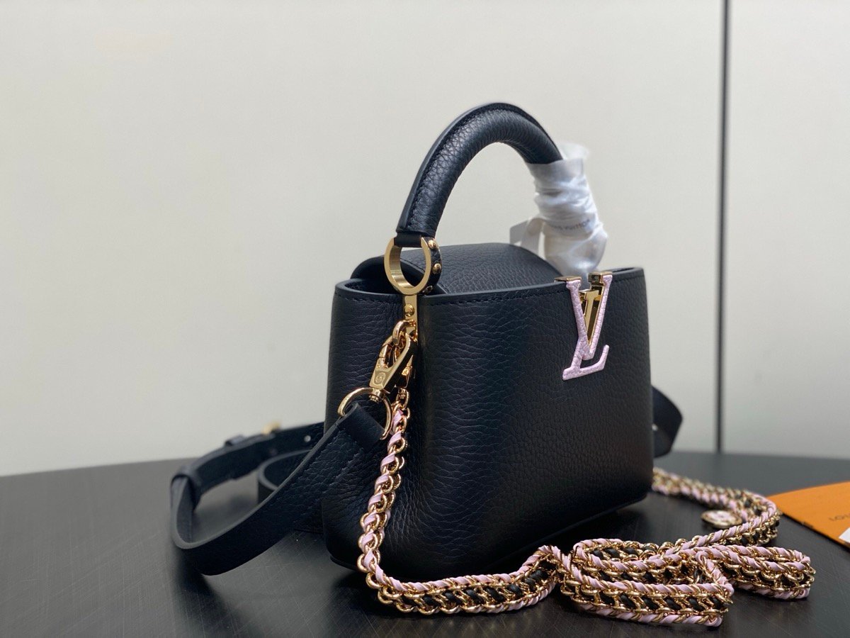 Black Braided Chain Top Handle Bag angle view with smooth leather texture and braided chain detail