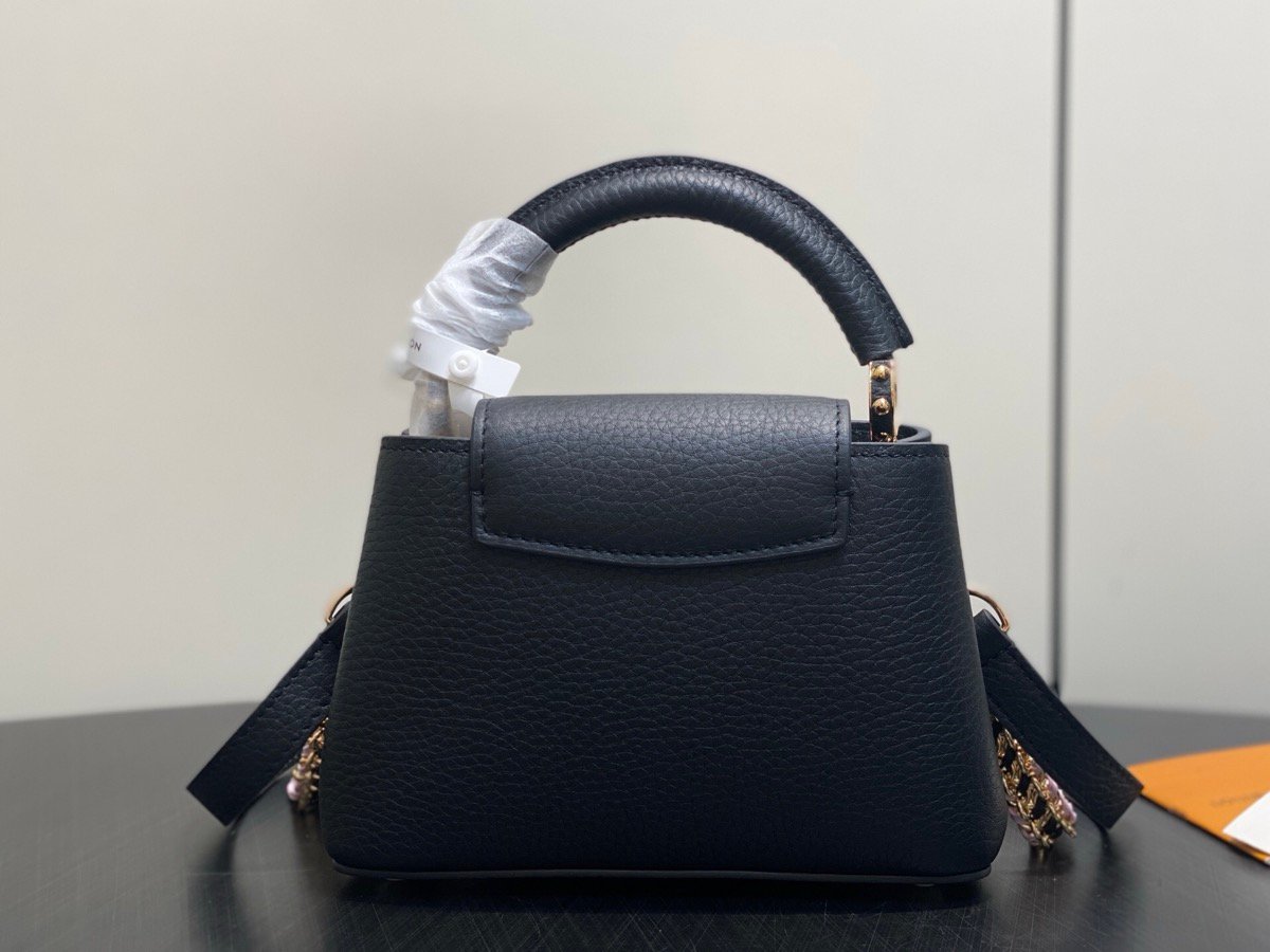 Black Braided Chain Top Handle Bag side view with smooth leather texture and braided chain detail