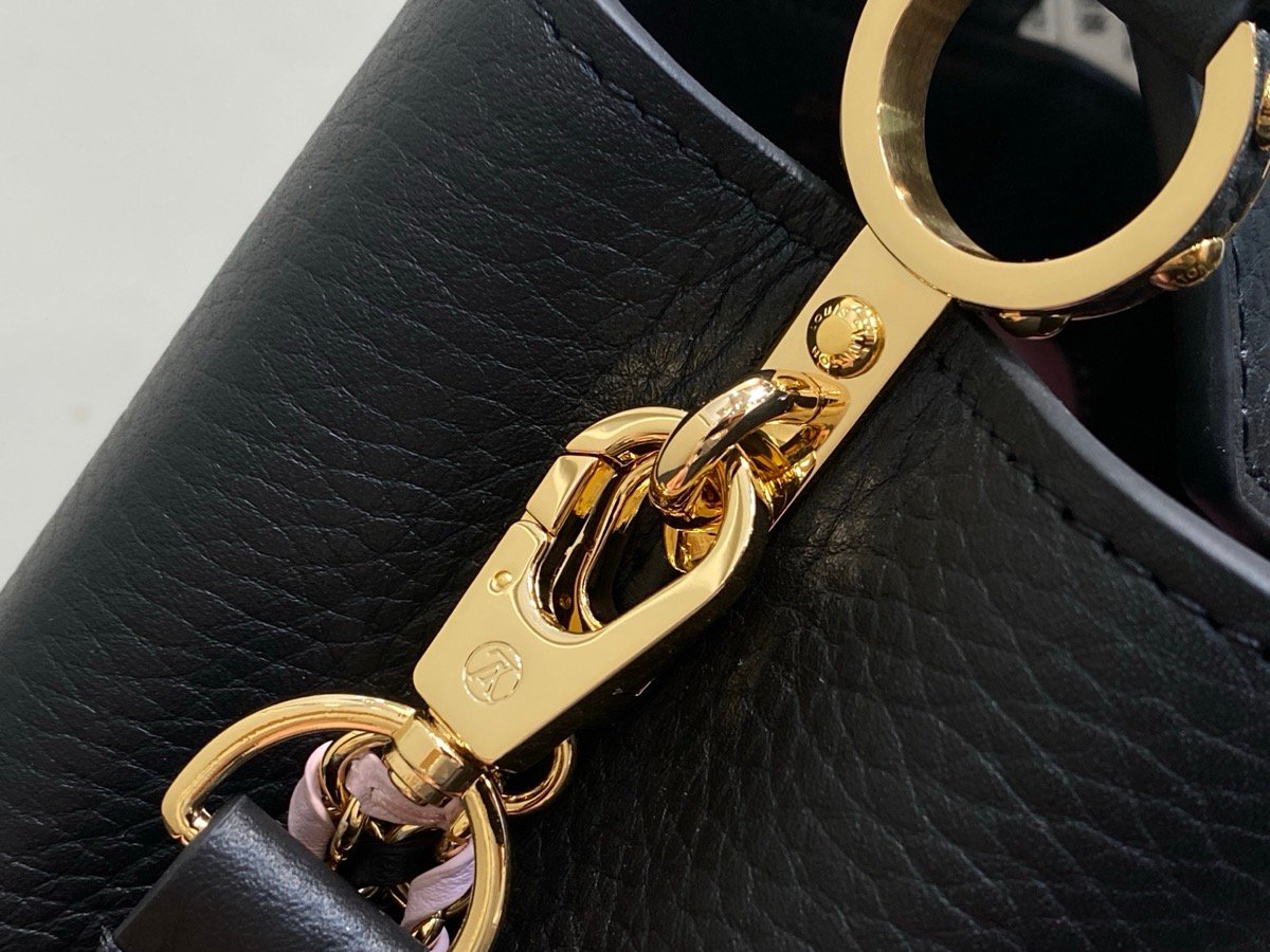 Black Braided Chain Top Handle Bag strap detail view with smooth leather texture and braided chain detail