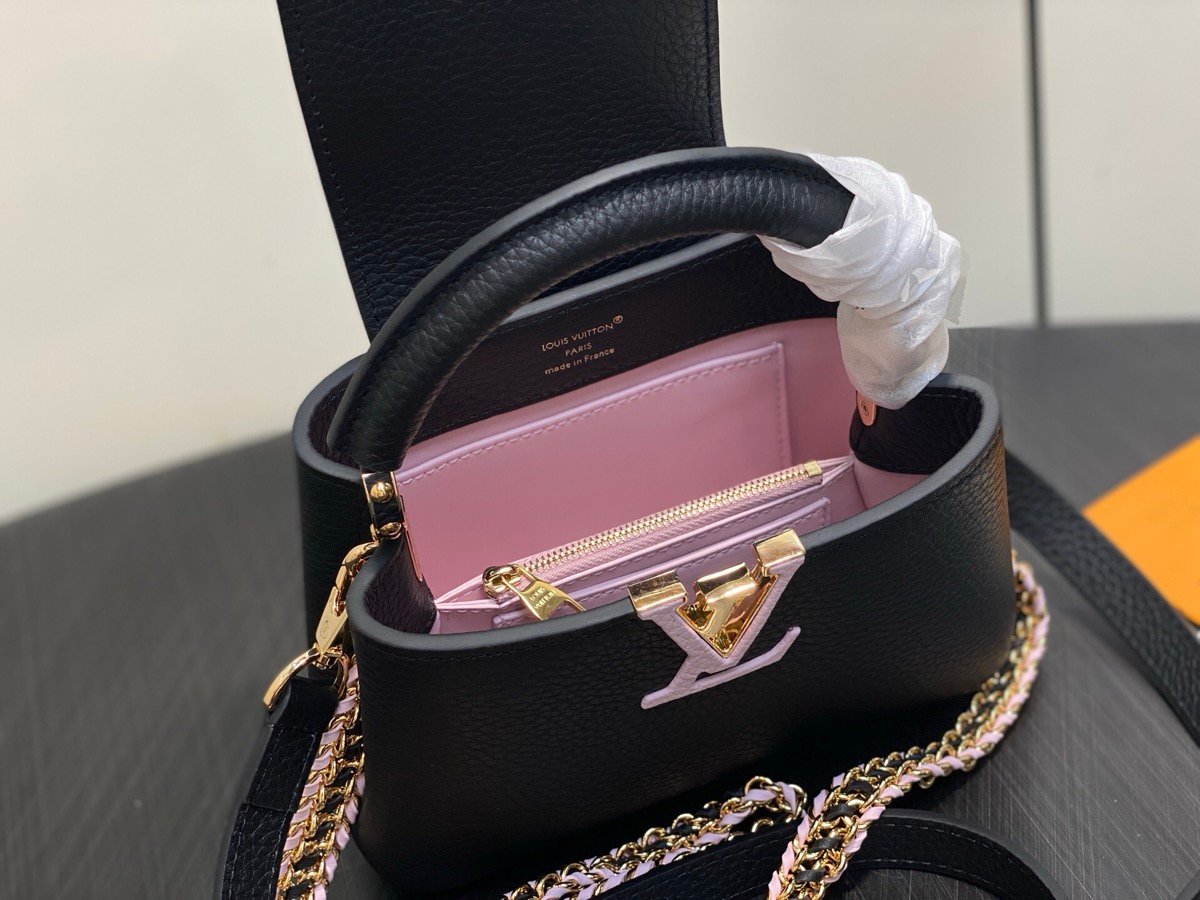 Black Braided Chain Top Handle Bag styling view with smooth leather texture and braided chain detail