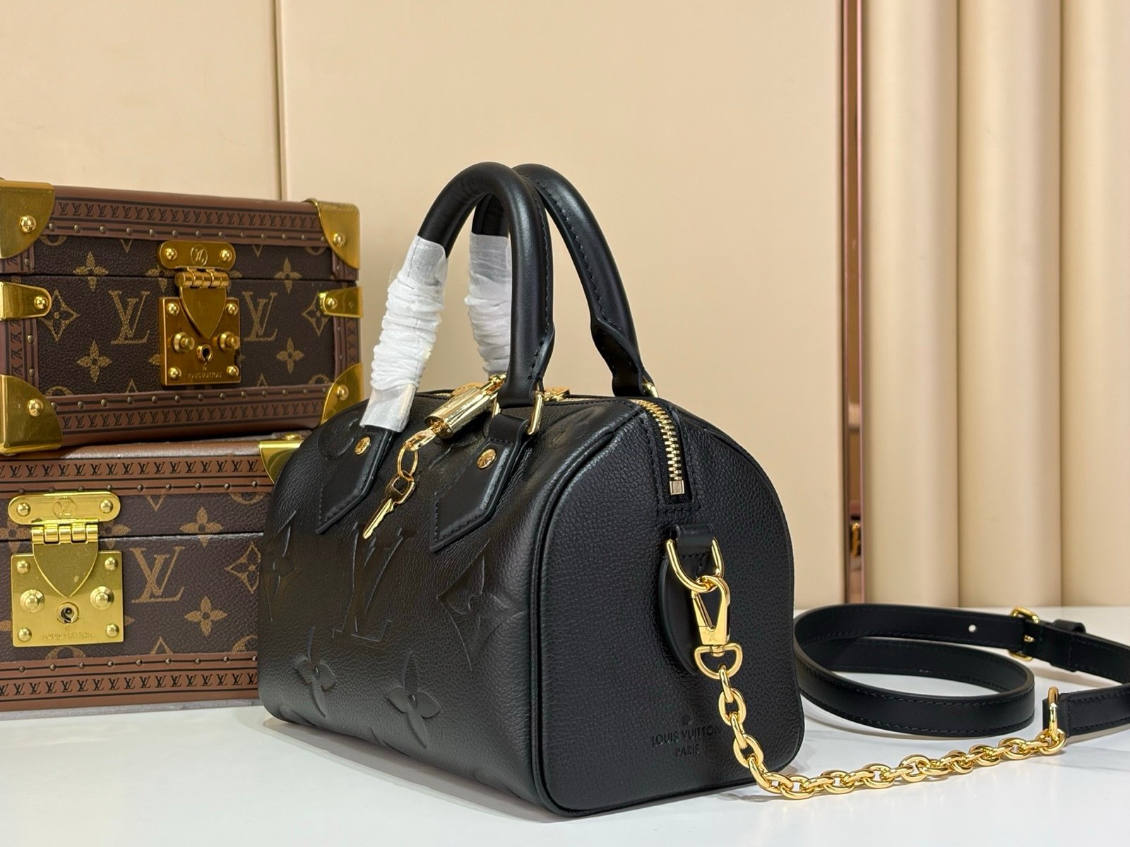 Black Embossed Compact Boston Bag angle view with embossed texture and silver tone hardware