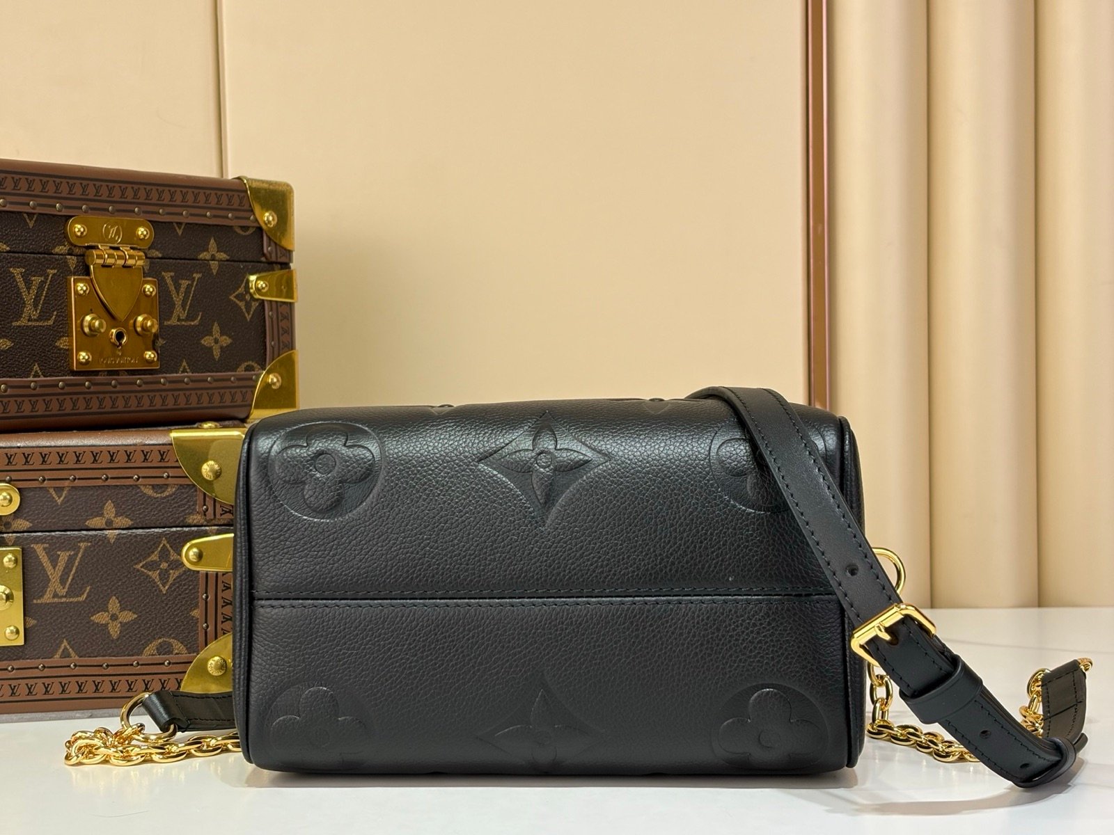 Black Embossed Compact Boston Bag back view with embossed texture and silver tone hardware