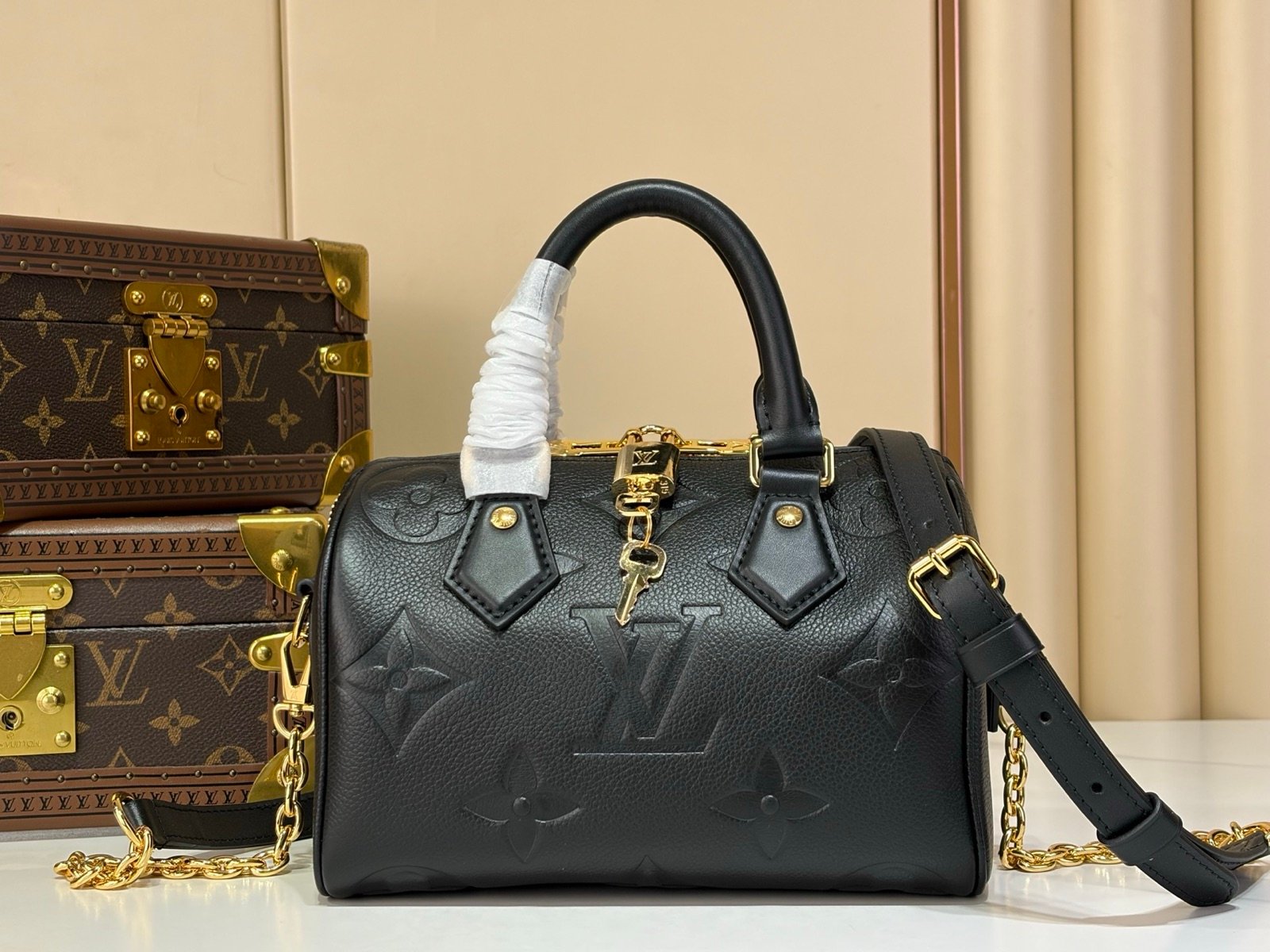 Black Embossed Compact Boston Bag detail view with embossed texture and silver tone hardware