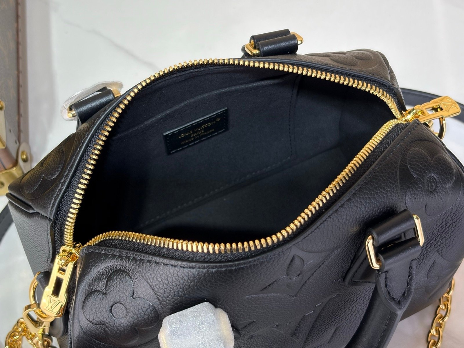 Black Embossed Compact Boston Bag interior view with embossed texture and silver tone hardware