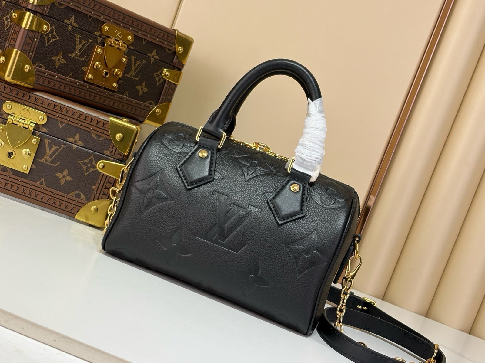 Black Embossed Compact Boston Bag side view with embossed texture and silver tone hardware