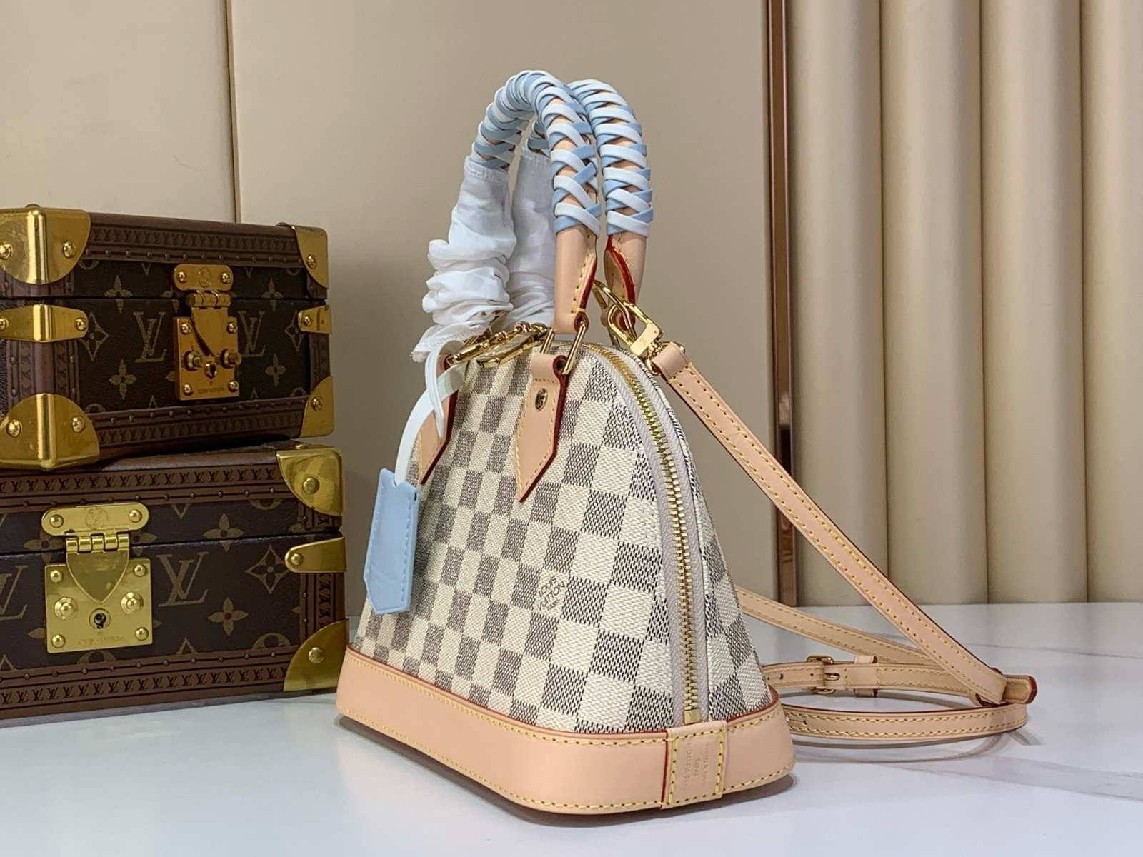 Blue Check Woven Top Handle Bag angle view with woven handle and checked texture
