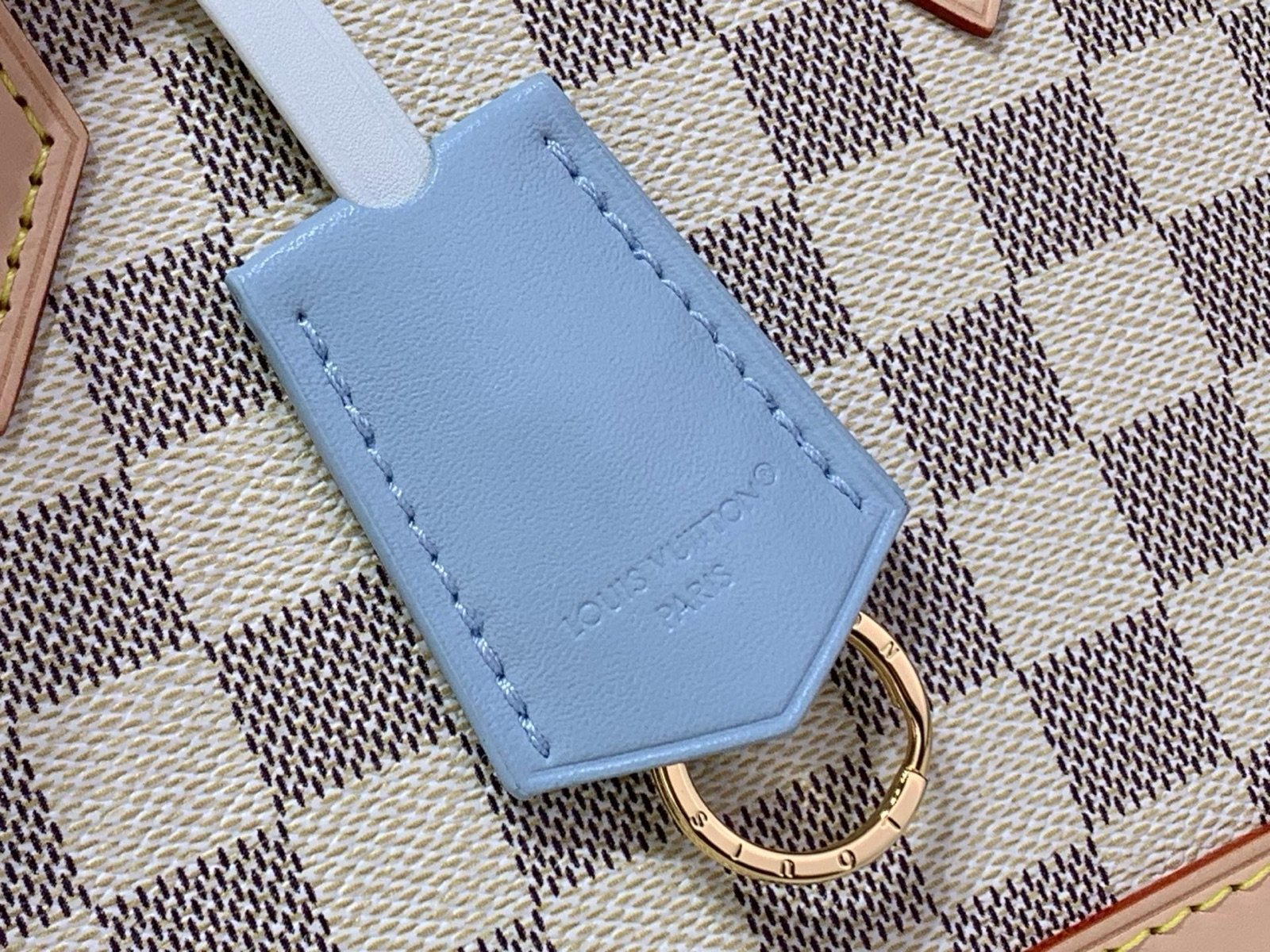 Blue Check Woven Top Handle Bag detail view with woven handle and checked texture