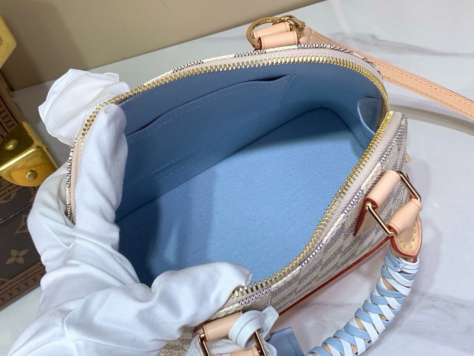 Blue Check Woven Top Handle Bag styling view with woven handle and checked texture