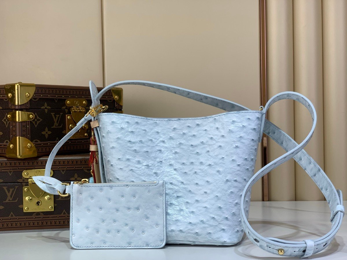 Blue Ostrich Texture Bucket Bag angle view with ostrich texture and polished hardware