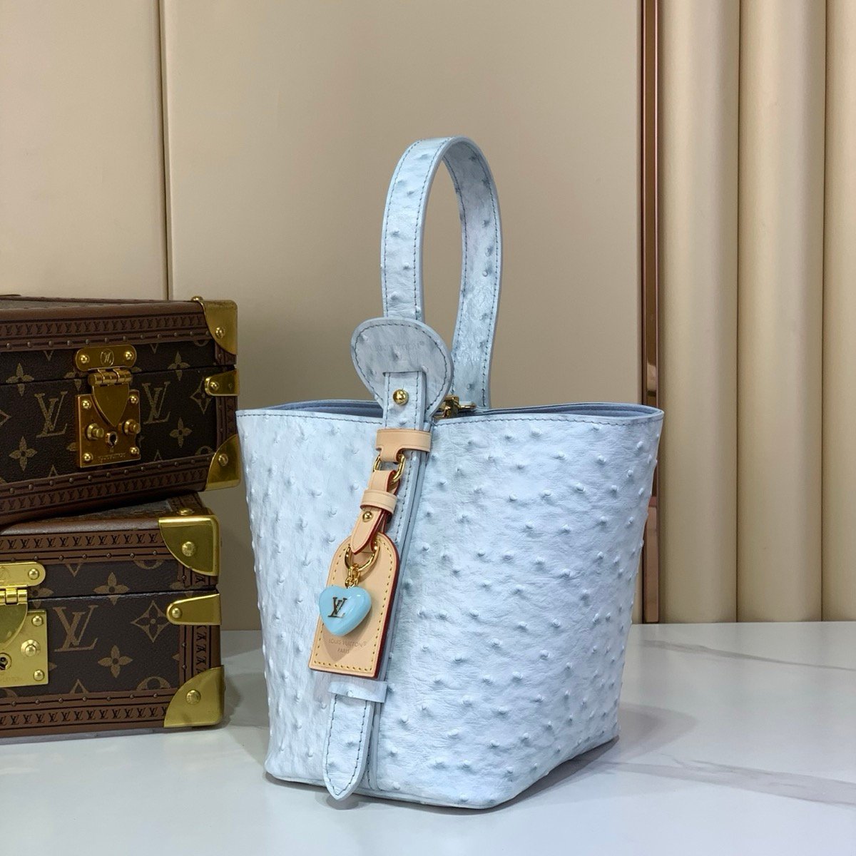 Blue Ostrich Texture Bucket Bag back view with ostrich texture and polished hardware