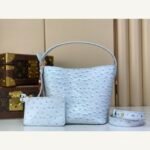 Blue Ostrich Texture Bucket Bag full front view on neutral thumbnail background