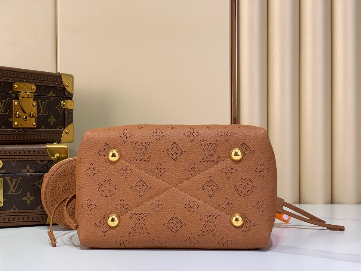 Brown Perforated Mini Bucket Bag back view with perforated leather texture and braided handle