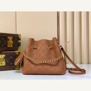 Brown Perforated Mini Bucket Bag full front view on neutral thumbnail background