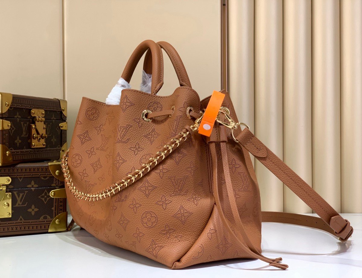 Brown Perforated Soft Tote Bag angle view with perforated leather texture and chain detail