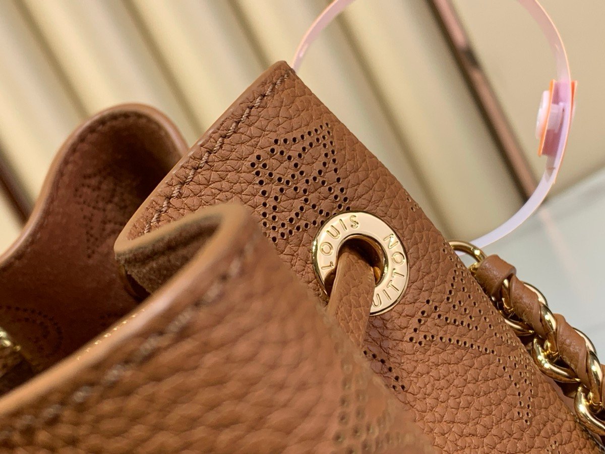 Brown Perforated Soft Tote Bag detail view with perforated leather texture and chain detail