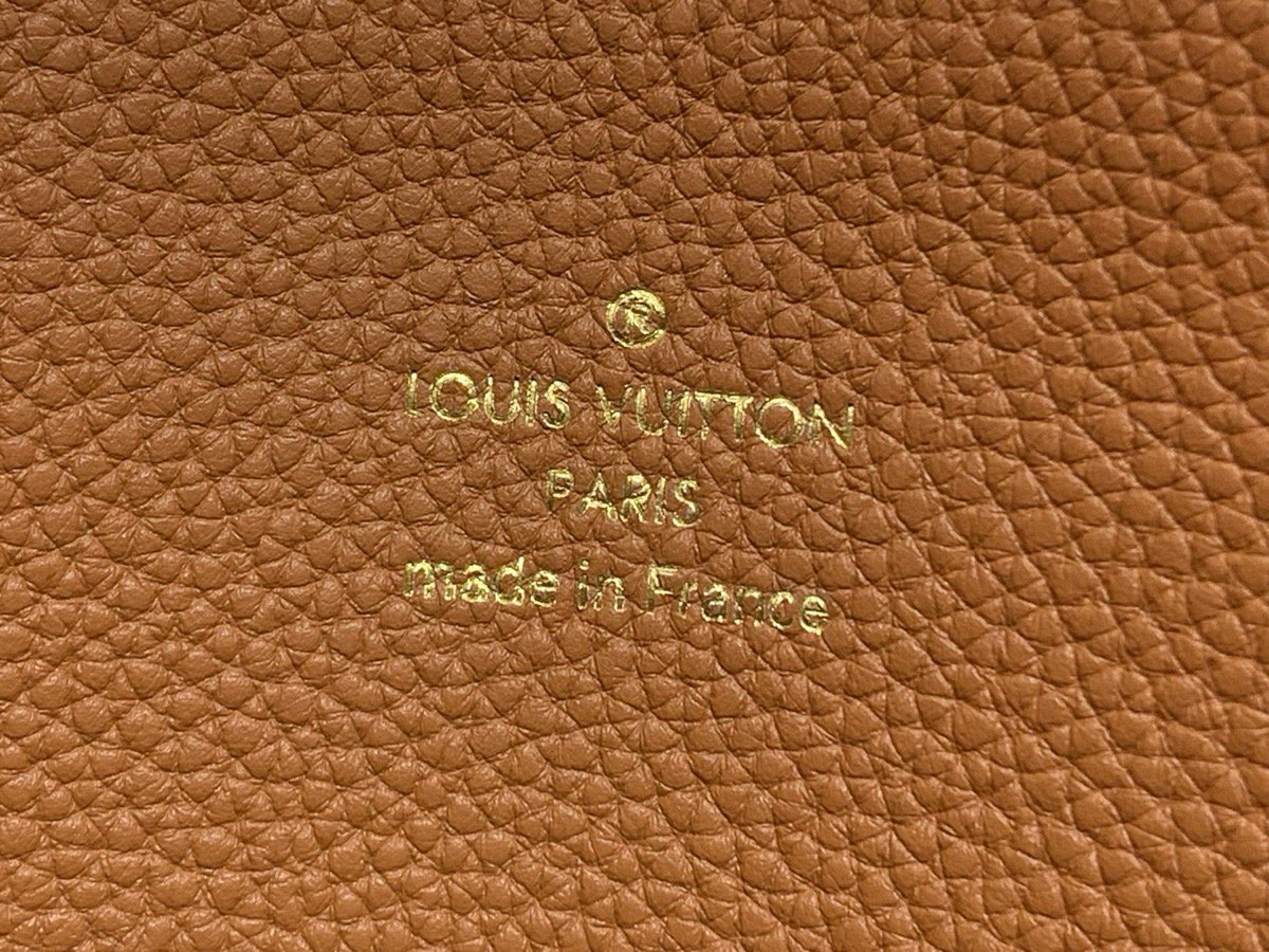 Brown Perforated Soft Tote Bag interior view with perforated leather texture and chain detail