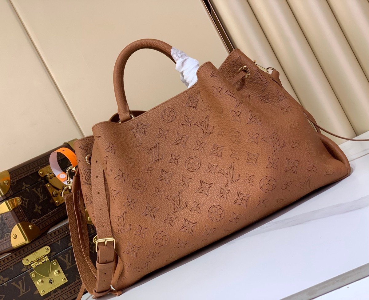 Brown Perforated Soft Tote Bag side view with perforated leather texture and chain detail