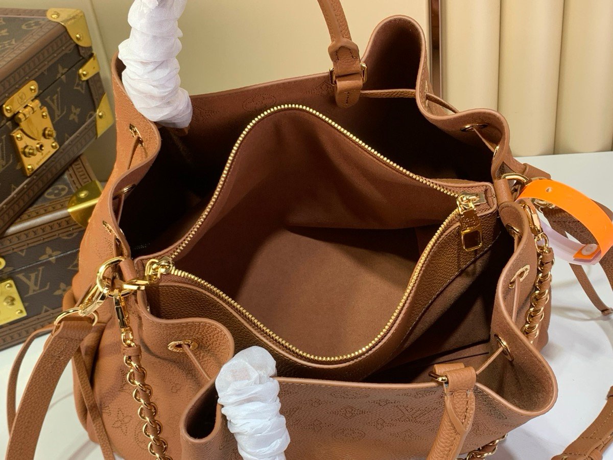 Brown Perforated Soft Tote Bag styling view with perforated leather texture and chain detail