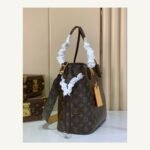 Brown Reversible Medium Tote Bag angle view with reversible styling and embossed texture on neutral thumbnail background