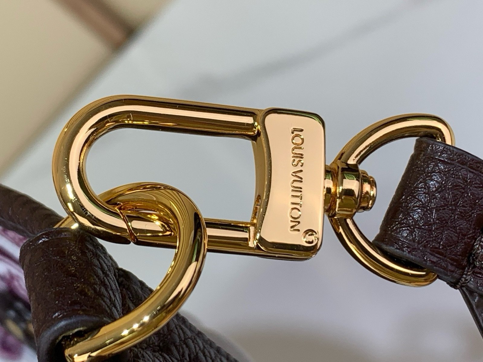Brown Reversible Medium Tote Bag hardware detail view with reversible styling and embossed texture