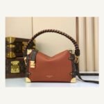 Brown Woven Medium Trunk Bag angle view with woven strap and gold tone hardware on neutral thumbnail background