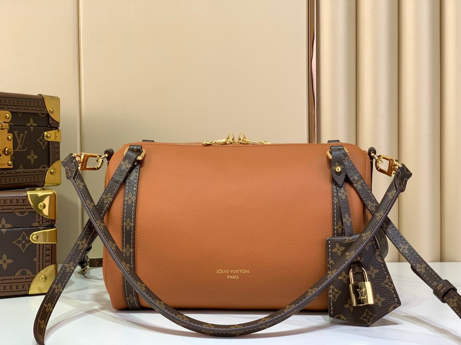 Cognac Brown Small Crossbody Bag front view with grained leather texture with patterned strap details