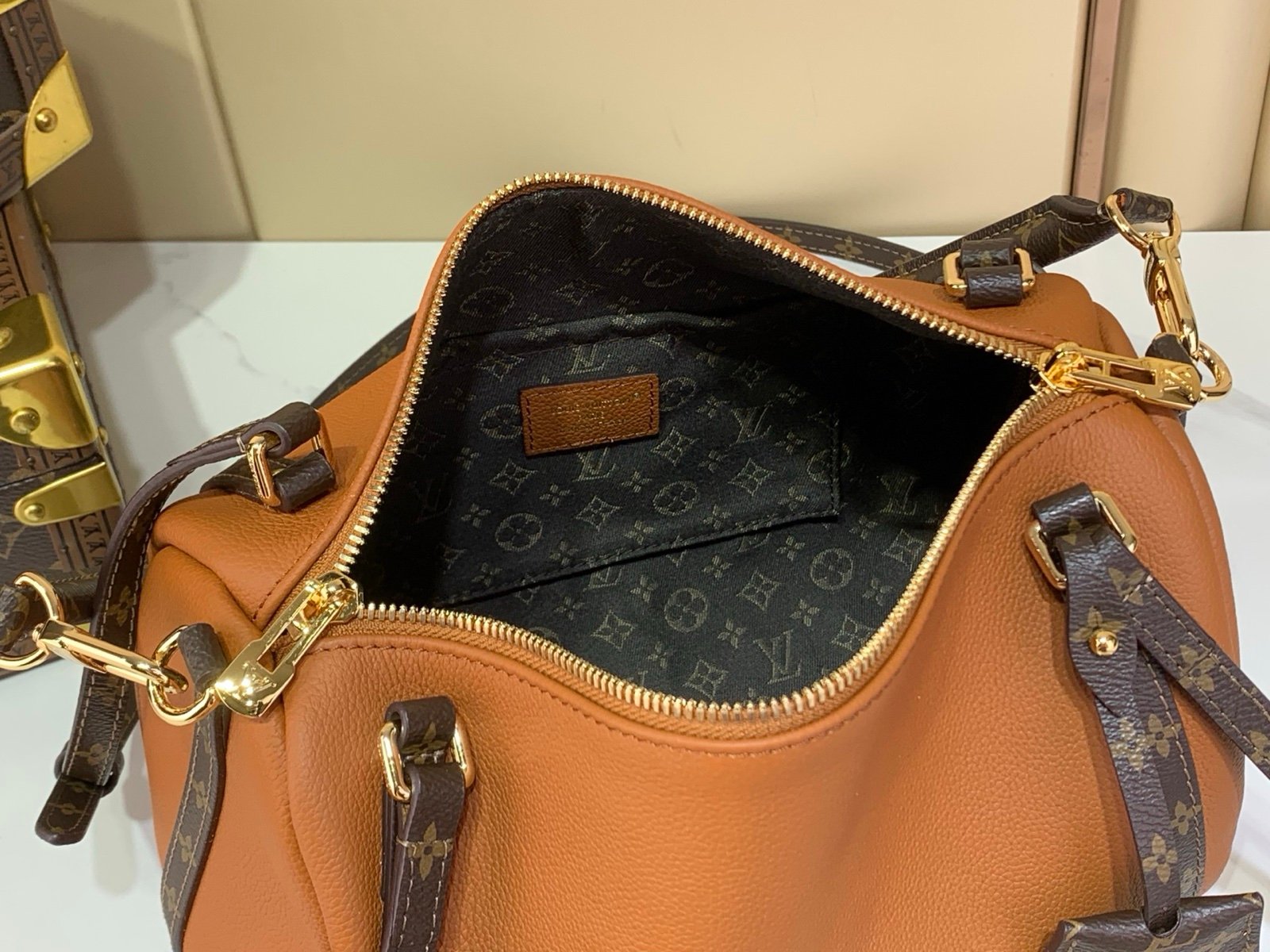 Cognac Brown Small Crossbody Bag interior view with grained leather texture with patterned strap details
