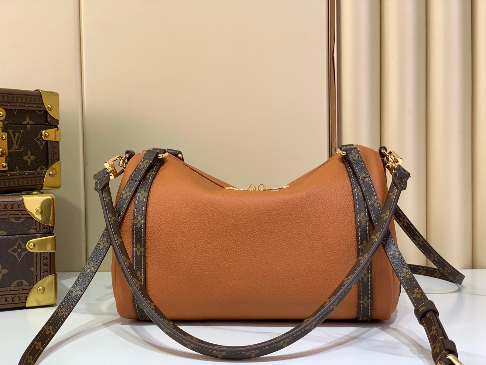 Cognac Brown Small Crossbody Bag side view with grained leather texture with patterned strap details