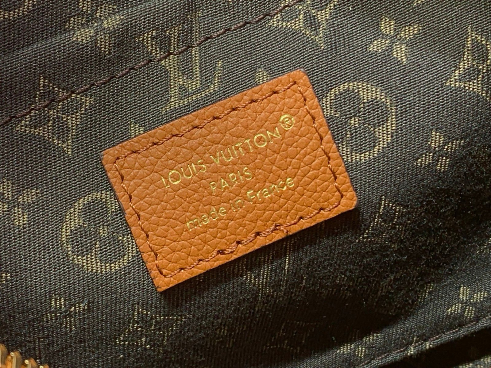 Cognac Brown Small Crossbody Bag styling view with grained leather texture with patterned strap details