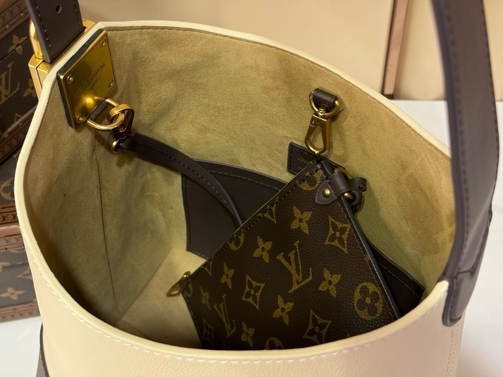 Cream Brown Hobo Shoulder Bag styling view with smooth two tone leather texture with a soft shoulder strap