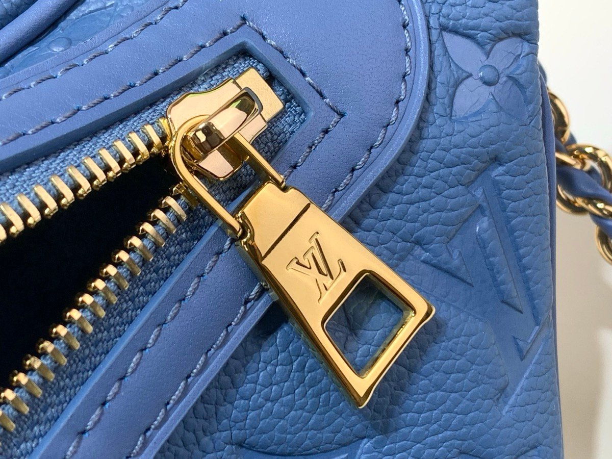 Mist Blue Belt Bag hardware detail view with grained texture and polished hardware