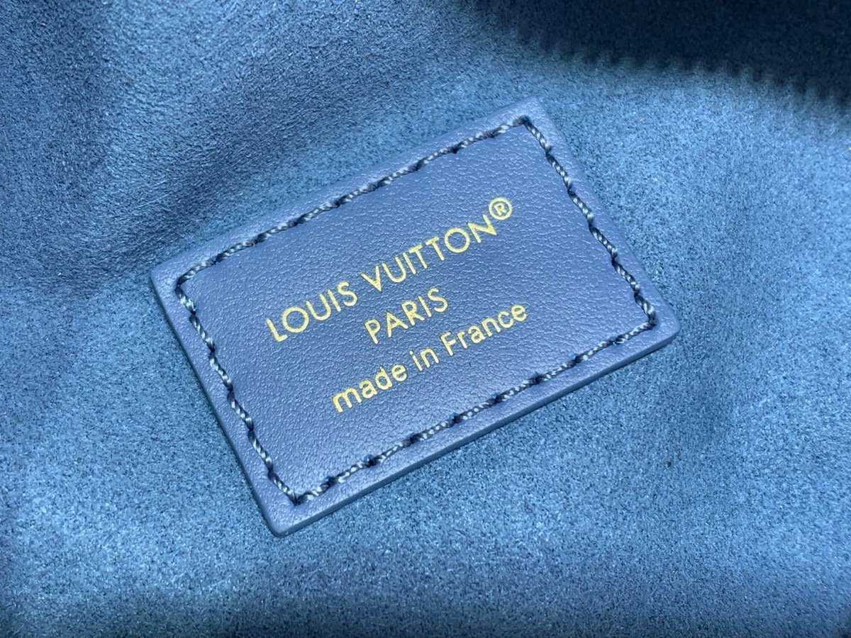 Mist Blue Belt Bag interior view with grained texture and polished hardware