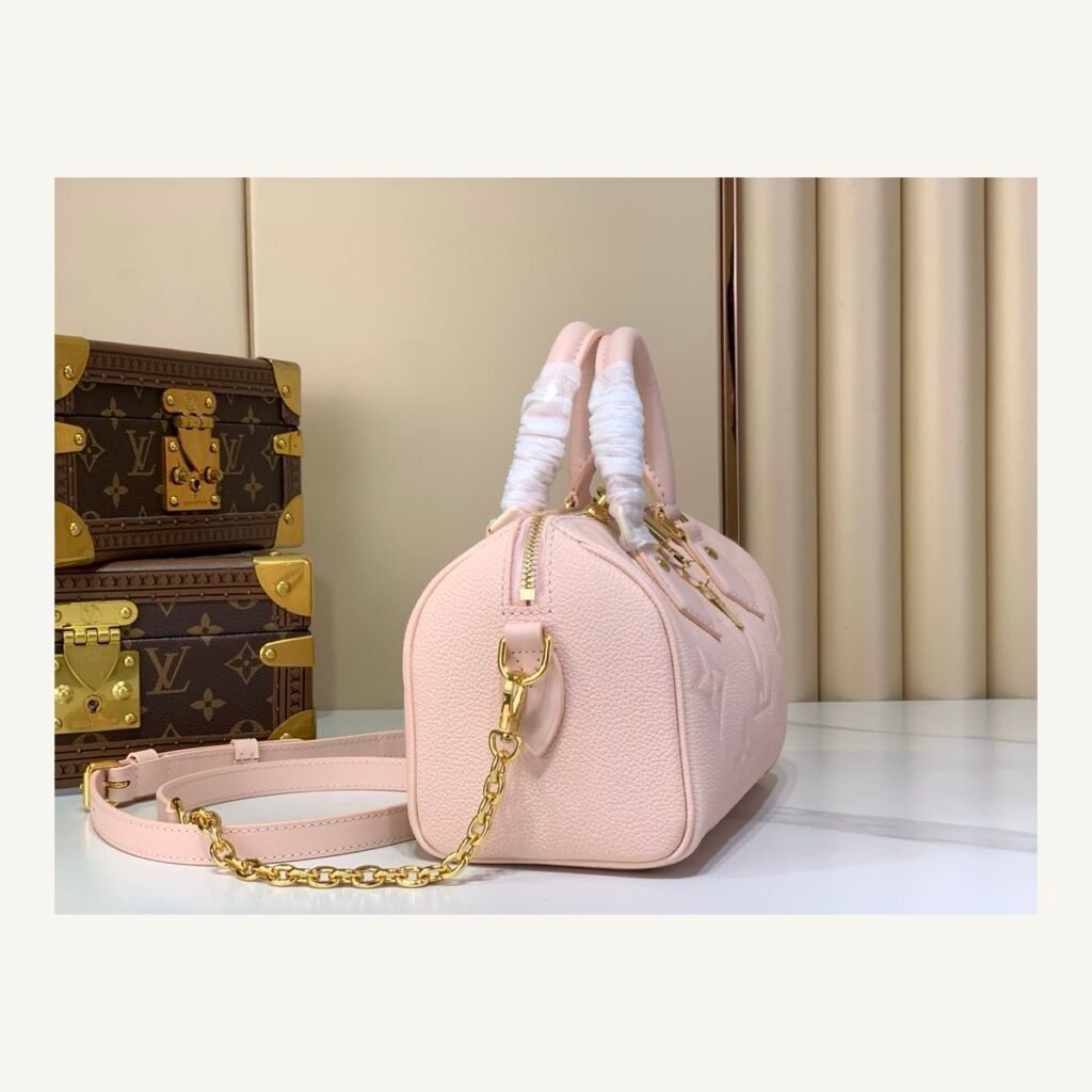 Pink Embossed Compact Boston Bag angle view with embossed texture and silver tone hardware on neutral thumbnail background