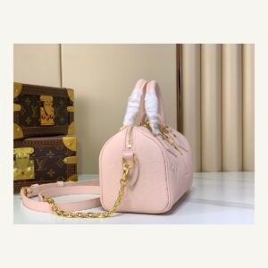 Pink Embossed Compact Boston Bag angle view with embossed texture and silver tone hardware on neutral thumbnail background