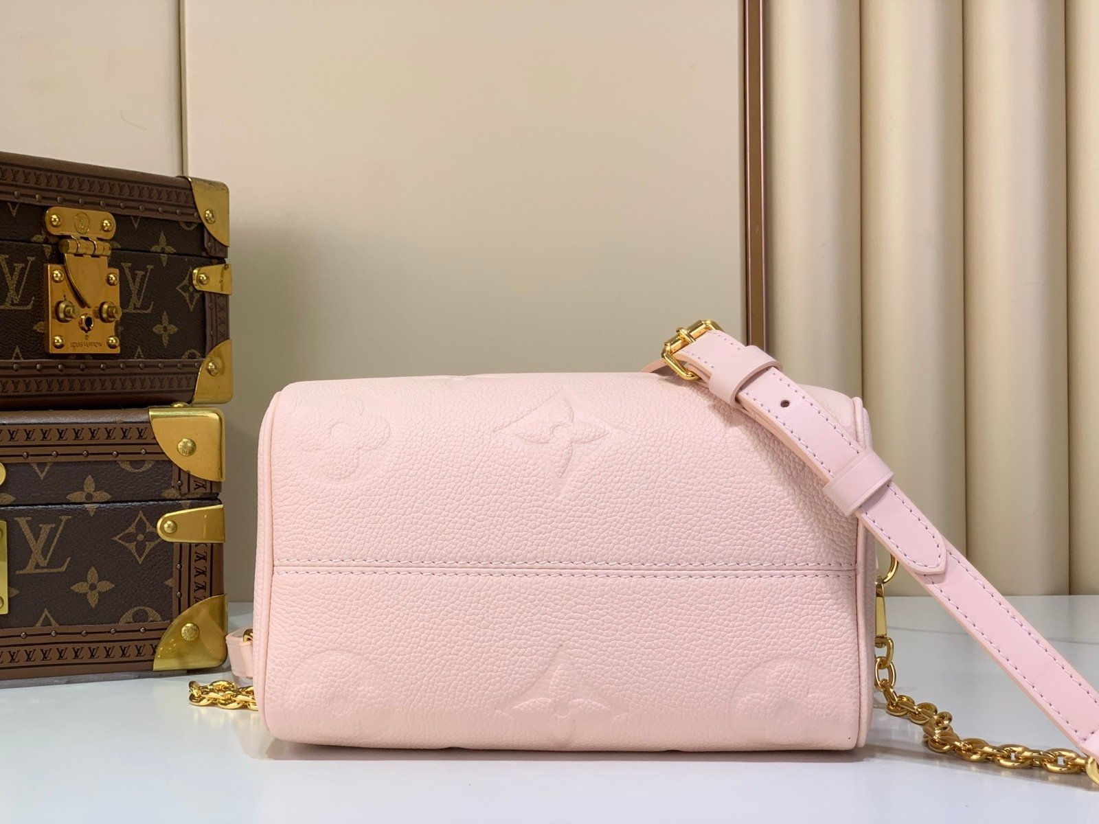 Pink Embossed Compact Boston Bag back view with embossed texture and silver tone hardware