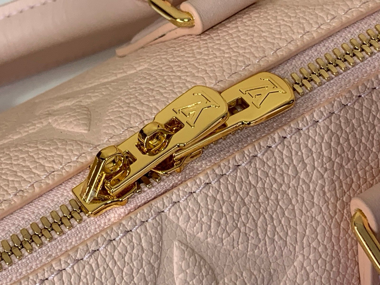 Pink Embossed Compact Boston Bag detail view with embossed texture and silver tone hardware