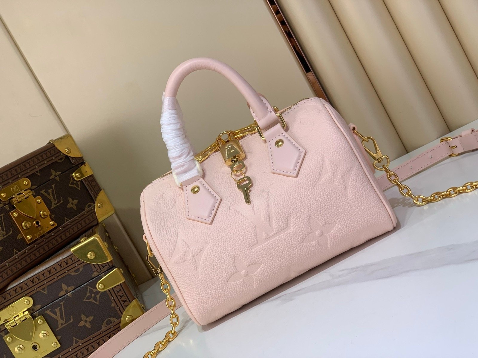 Pink Embossed Compact Boston Bag interior view with embossed texture and silver tone hardware