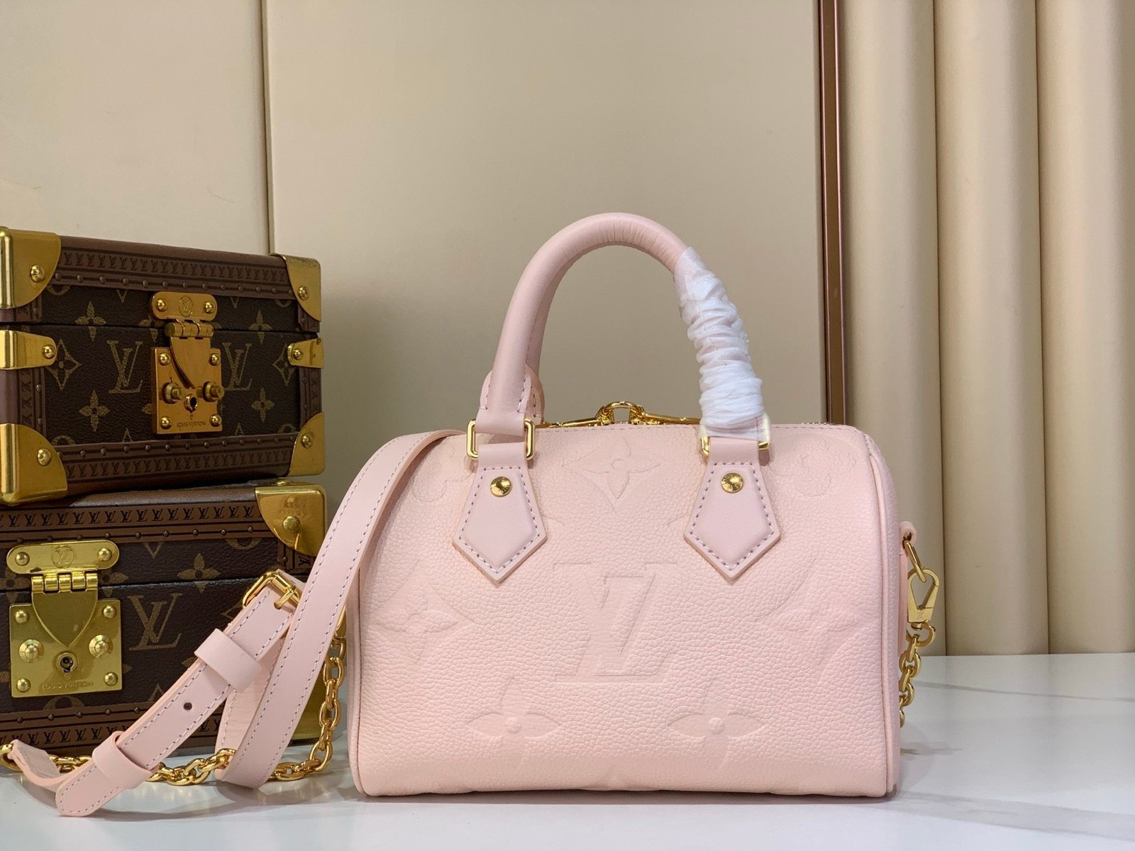 Pink Embossed Compact Boston Bag side view with embossed texture and silver tone hardware