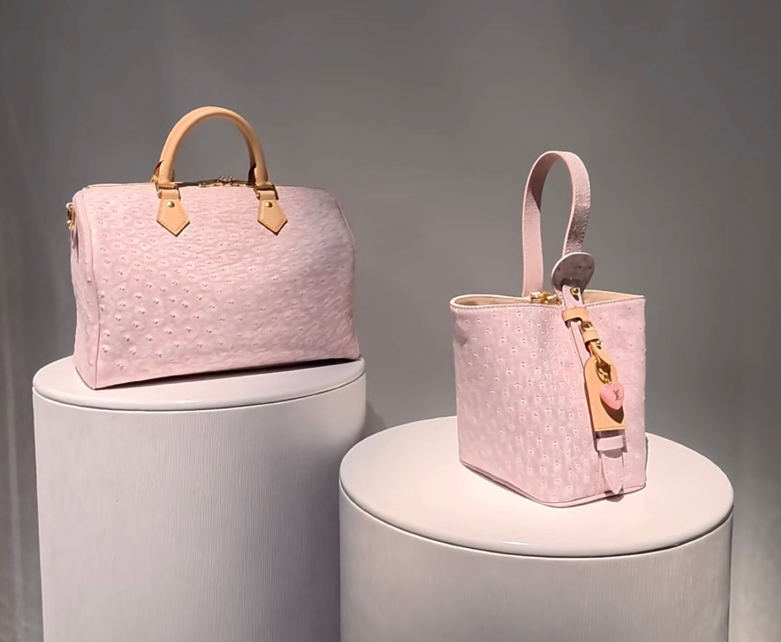 Pink Ostrich Texture Bucket Bag back view with ostrich texture and smooth trim