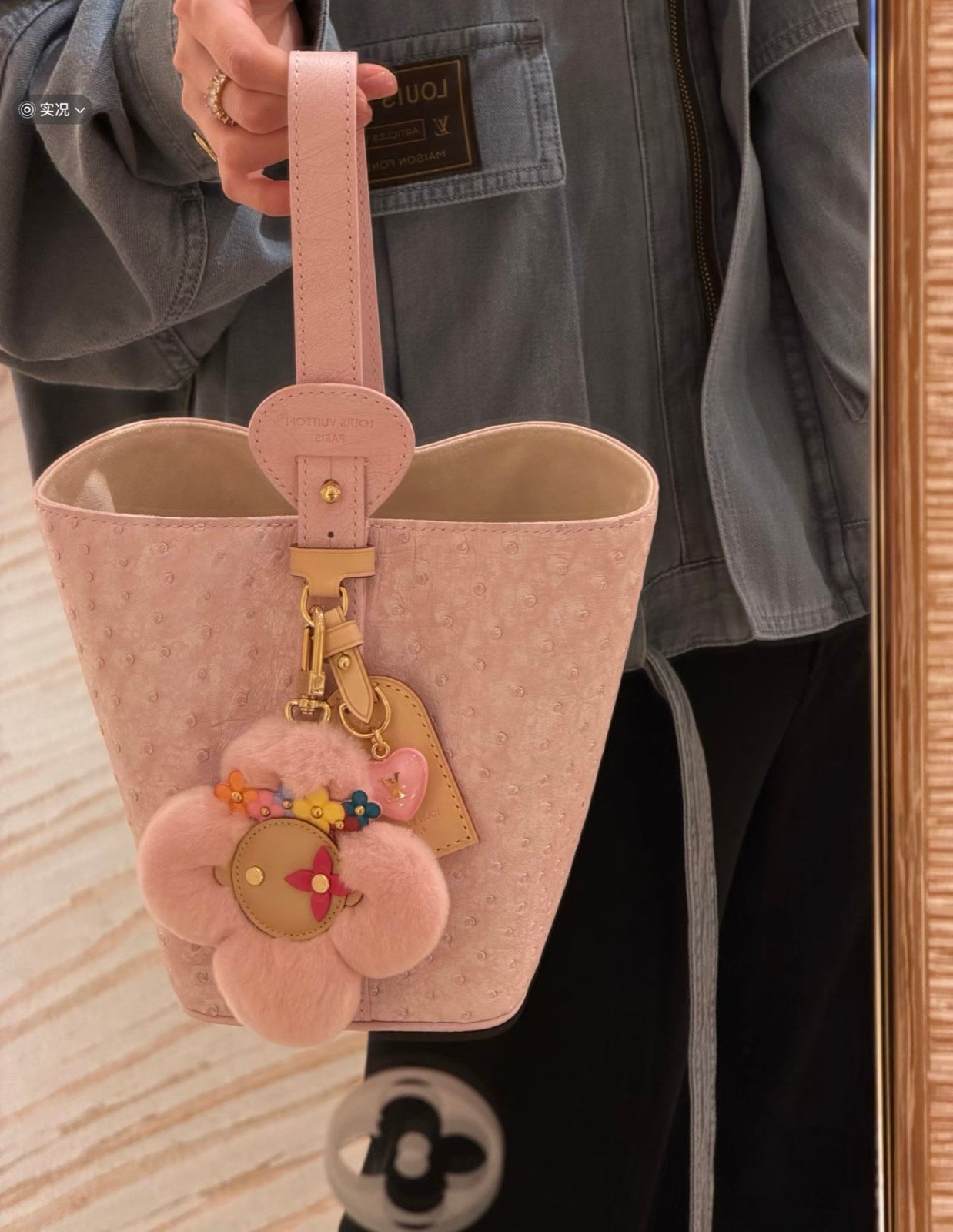 Pink Ostrich Texture Bucket Bag hardware detail view with ostrich texture and smooth trim