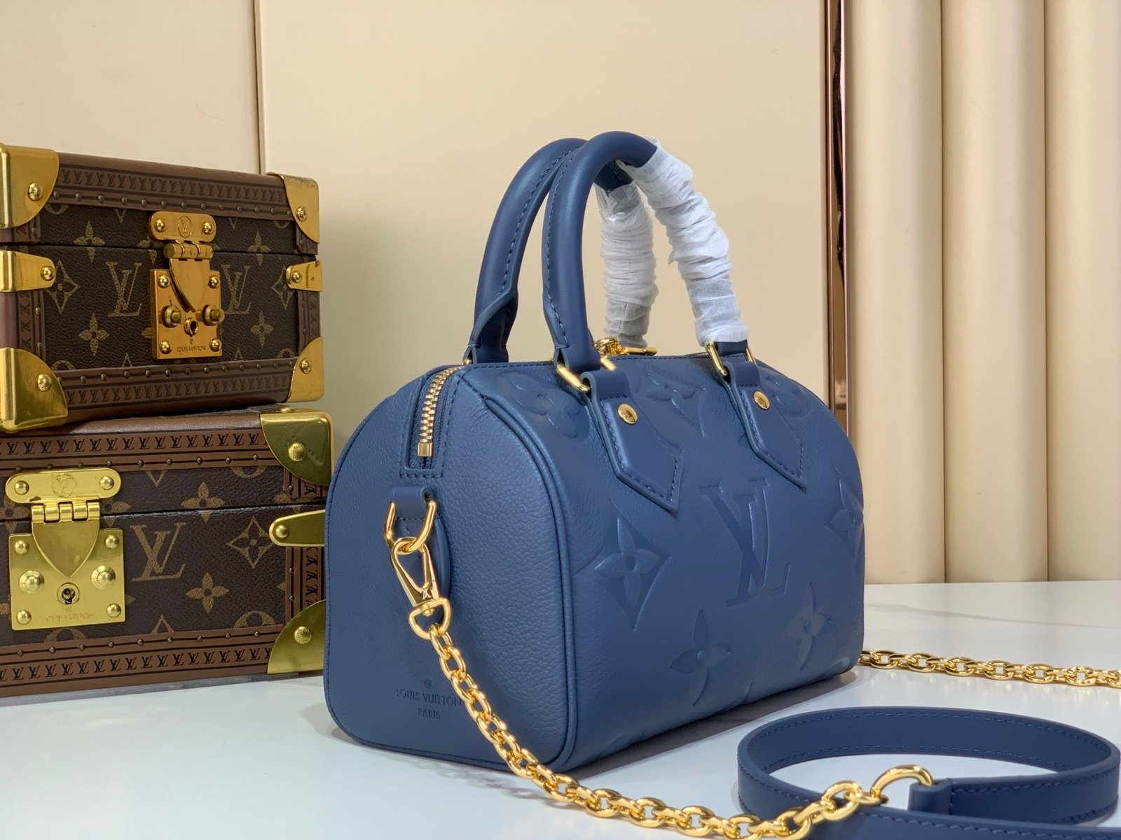 Royal Blue Embossed Compact Boston Bag angle view with embossed texture and silver tone hardware