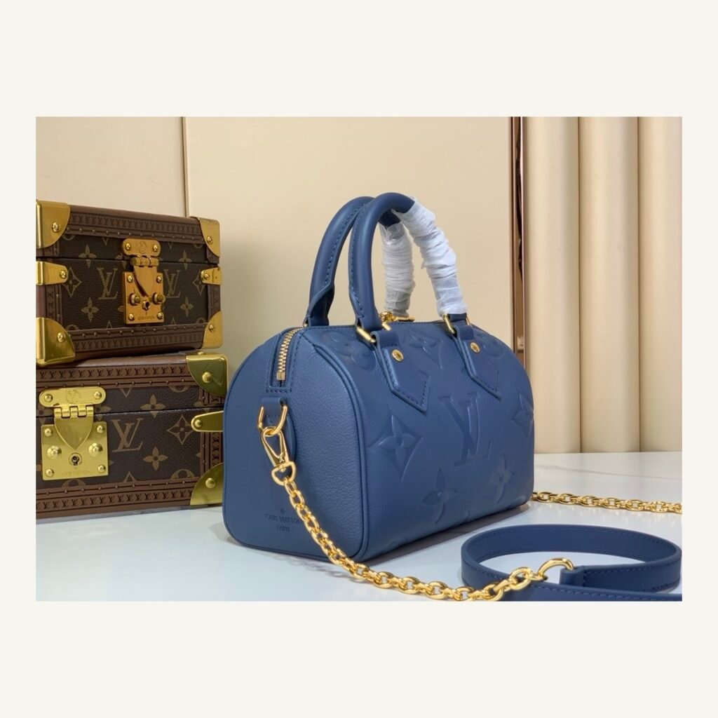 Royal Blue Embossed Compact Boston Bag angle view with embossed texture and silver tone hardware on neutral thumbnail background