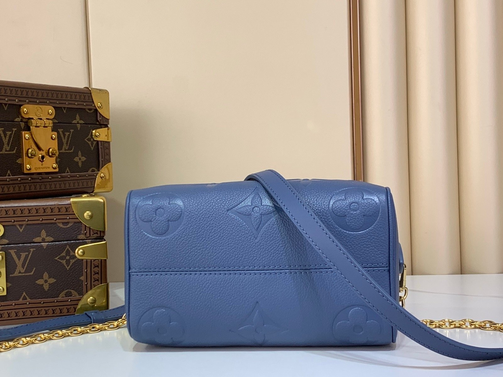 Royal Blue Embossed Compact Boston Bag back view with embossed texture and silver tone hardware