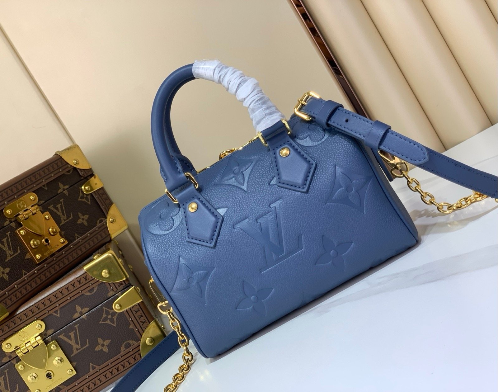Royal Blue Embossed Compact Boston Bag side view with embossed texture and silver tone hardware