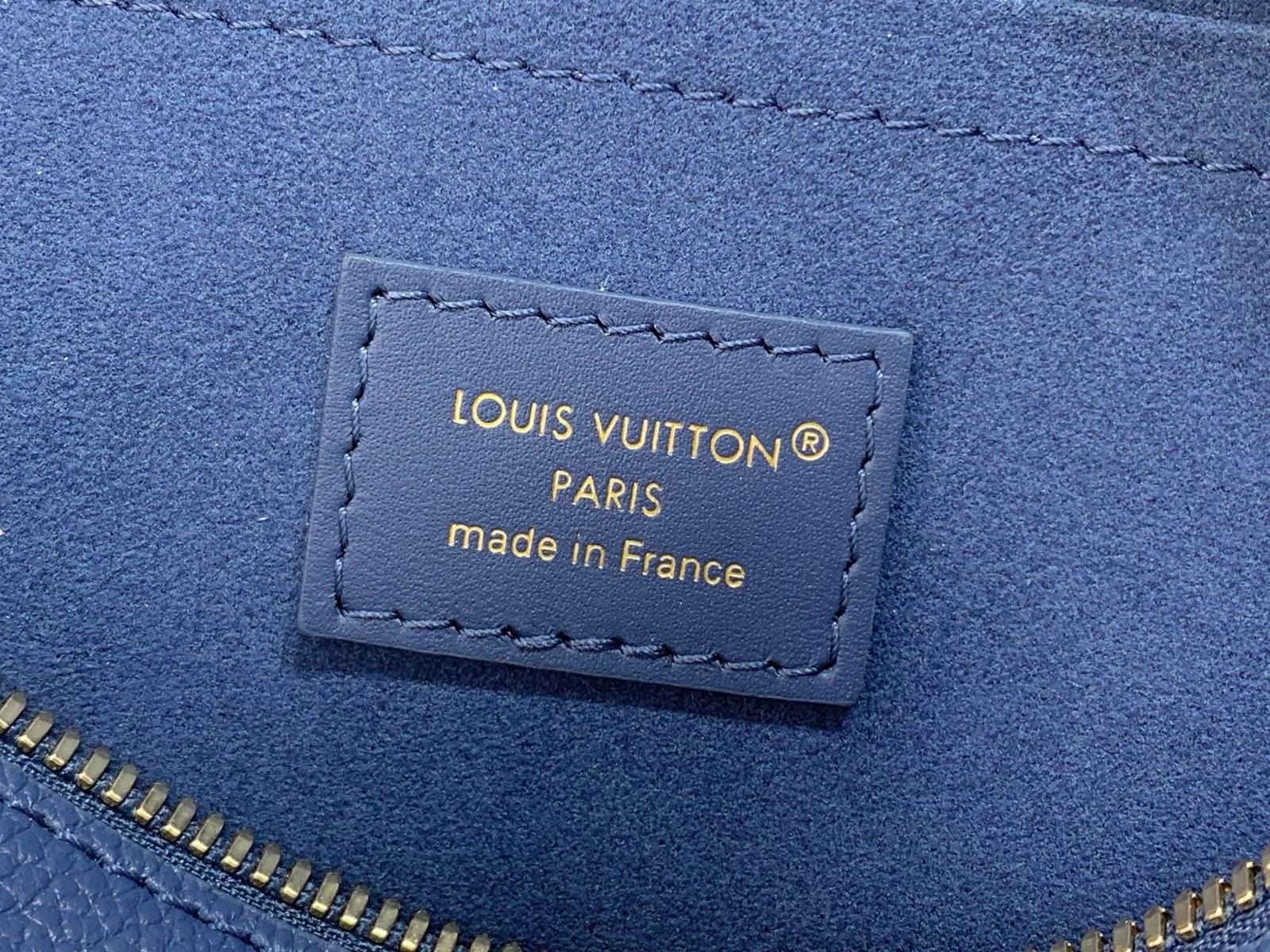 Royal Blue Embossed Compact Boston Bag strap detail view with embossed texture and silver tone hardware