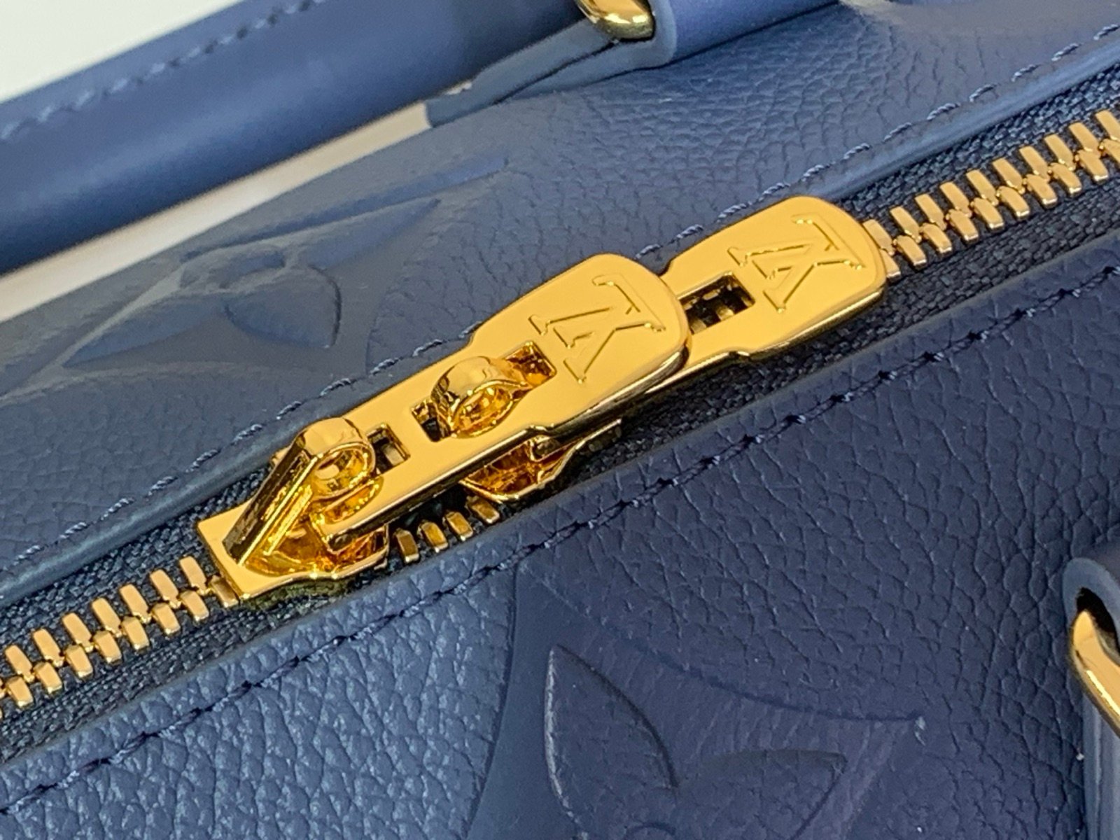 Royal Blue Embossed Compact Boston Bag styling view with embossed texture and silver tone hardware