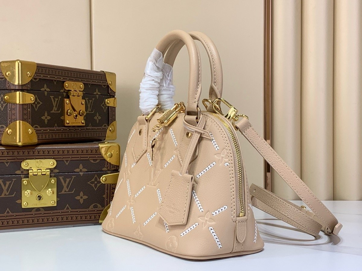 Taupe Embroidered Top Handle Bag angle view with embroidered texture and smooth trim