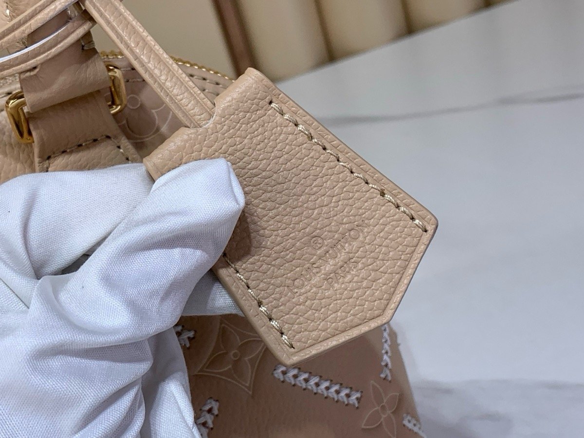 Taupe Embroidered Top Handle Bag detail view with embroidered texture and smooth trim