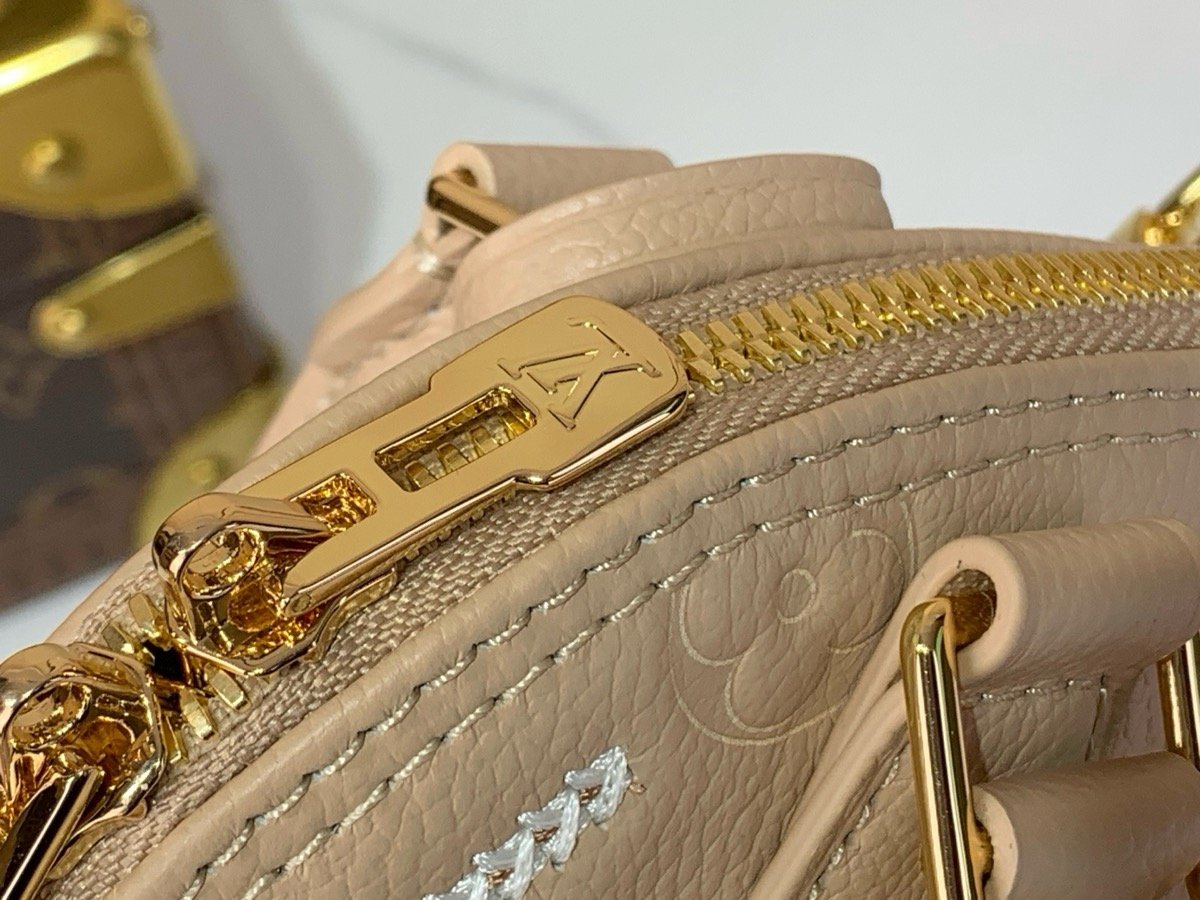 Taupe Embroidered Top Handle Bag hardware detail view with embroidered texture and smooth trim