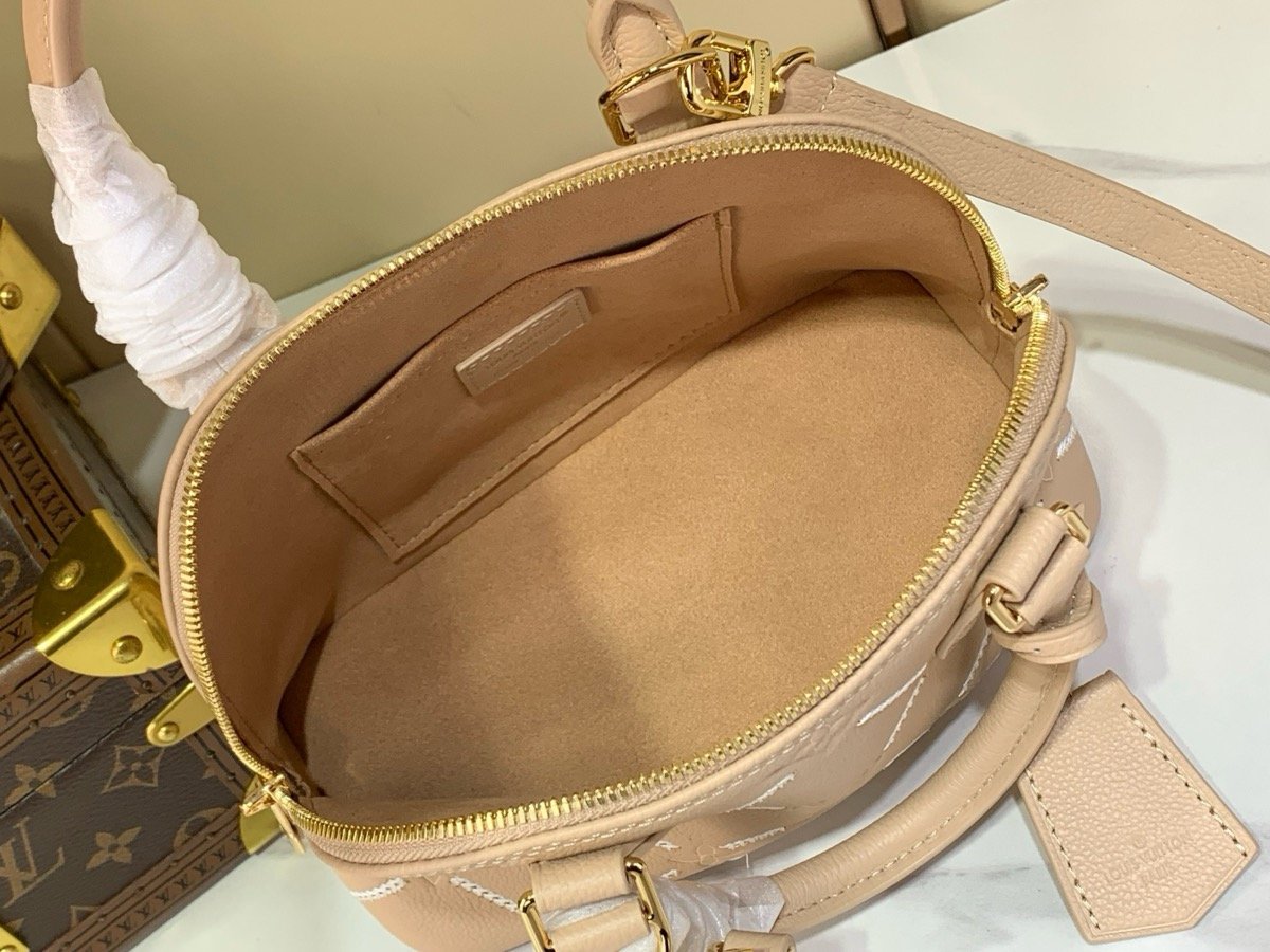 Taupe Embroidered Top Handle Bag interior view with embroidered texture and smooth trim